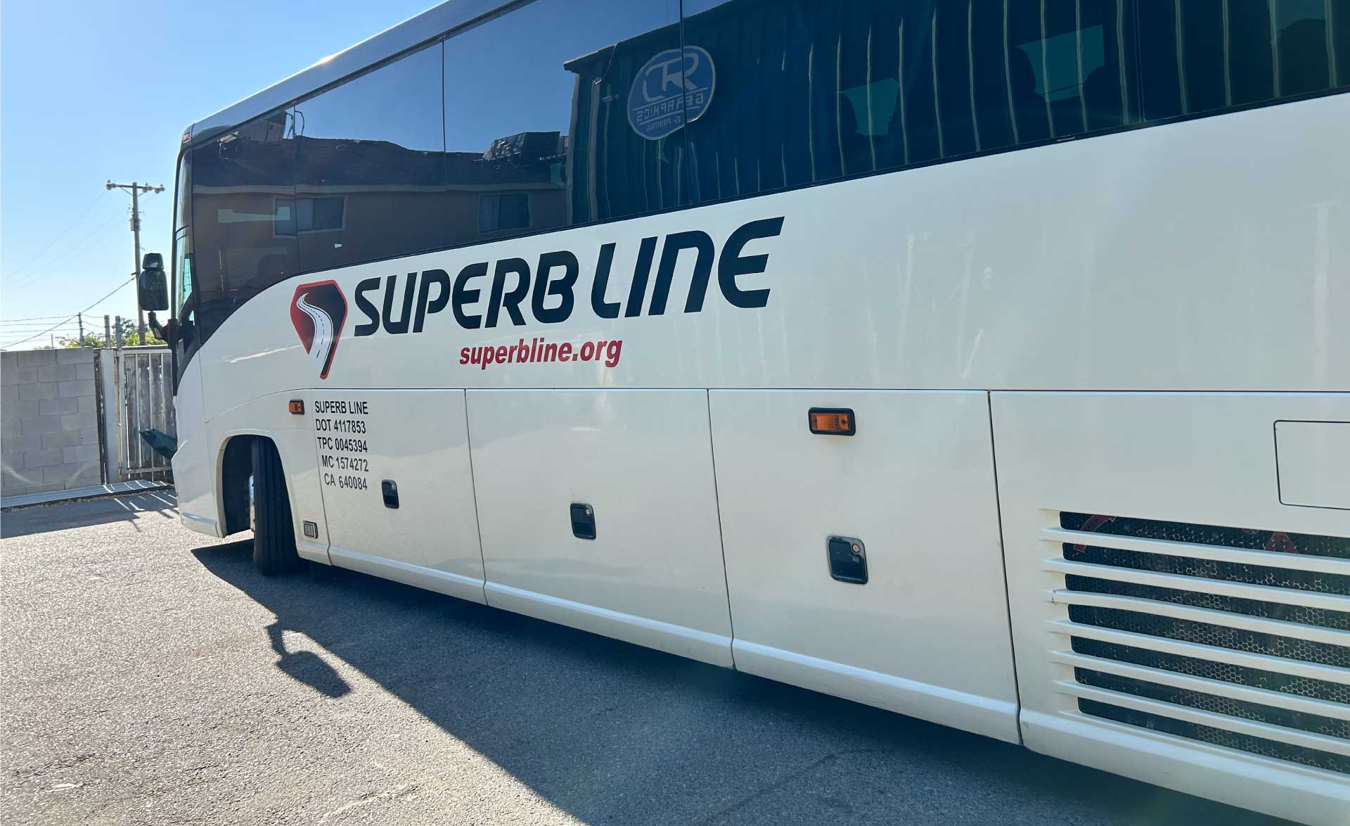A modern charter bus in Tulare, ca driving along a scenic California highway, showcasing safe and reliable group transportation with our california charter bus  services