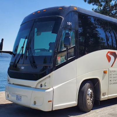 A modern charter bus in selma, ca equipped with amenities like Wi-Fi and climate control, ideal for corporate travel from Selma to a conference.